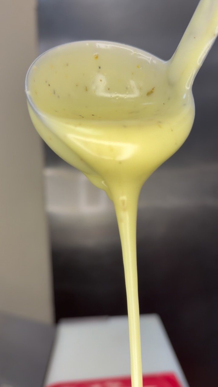 Homemade dressing being poured